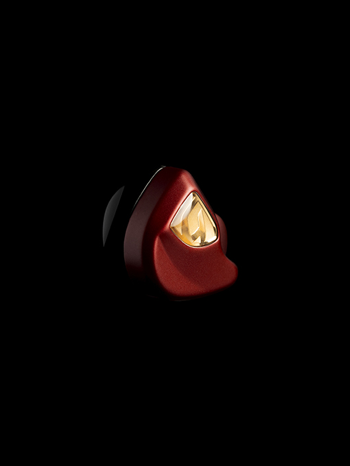 Todi in-ear on black background with red cover anodized highlighted